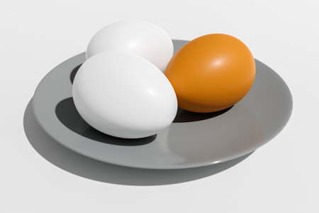 Chicken eggs lie in a ceramic plate on a white background.の写真素材