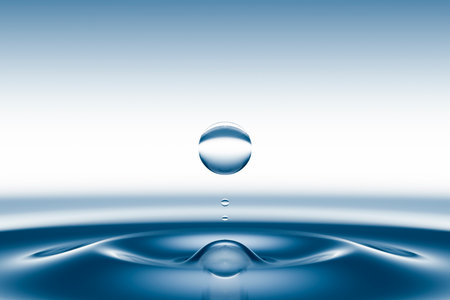 A drop of clean water and circles on the surface.の写真素材