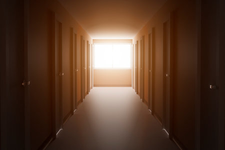 A long corridor with offices in an industrial building.の写真素材