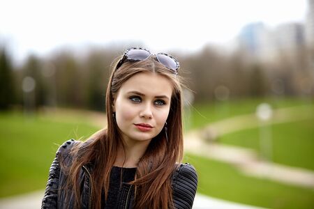 Fashion concept. Portrait close up of young beautiful fashionable brunette woman.  City lifestyle....