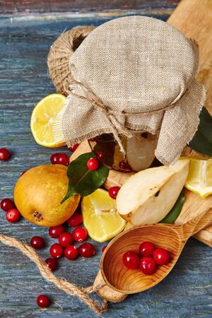 Berry and fruit jam with ingredients on a dark rustic background. Copy space, top view.の写真素材