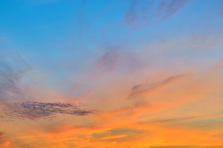 Romantic heavenly sunset landscape in orange tonesの写真素材