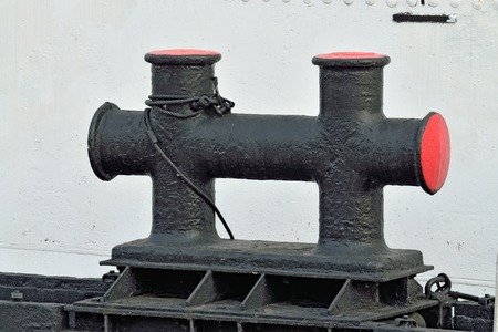 Black cast iron bollard on the pier