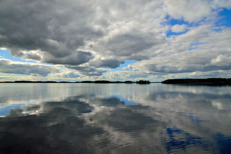 White nights at lake Keret, Mirror image. Northern Karelia, Russiaの写真素材