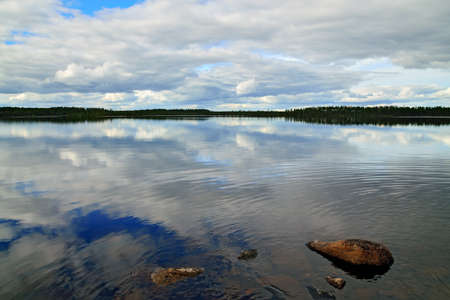 Clouds fly across the sky. Lake Keret, Northern Karelia, Russia