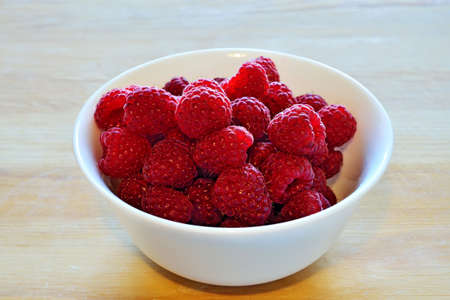 Ripe juicy red raspberry berries close up. Natural vitamin food
