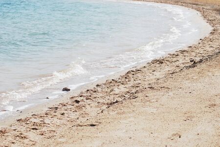 sand beach with sea waves in Egyptの写真素材