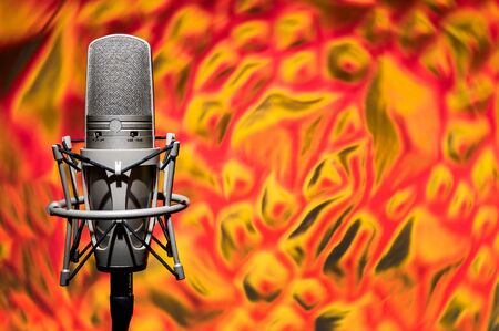 Professional, studio microphone on a background of a fiery rotating background. Located on the left.
Can be used for audio, karaoke and music content.の写真素材