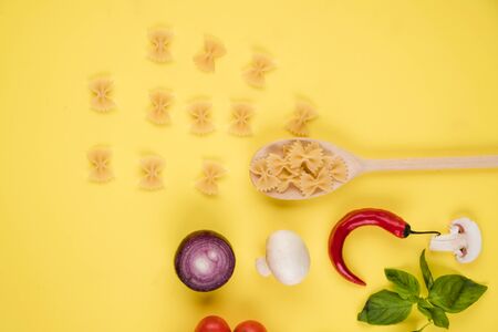 Italian food or ingredients background with fresh vegetables, pasta, cheese parmesan and spices. Top...