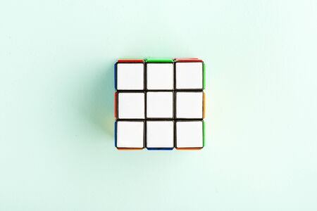 Kyiv, Ukraine - May 17th, 2017: Rubik's cube on the light blue background, top view. Rubik's cube invented by a Hungarian architect Erno Rubik in 1974.のeditorial素材