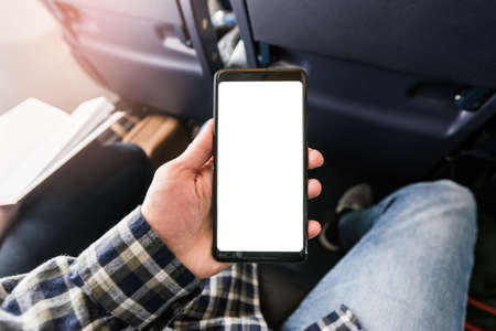 Closeup mockup image of white empty blank smartphone in the male handの写真素材