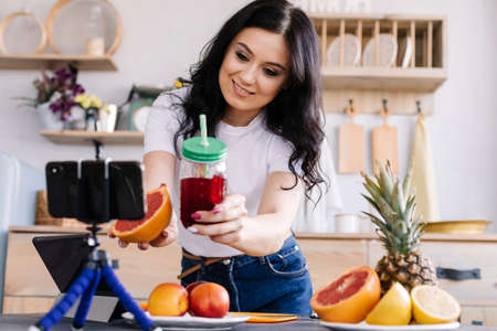 The beautiful brunette shows the subscribers a strip she has preparedの写真素材