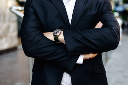 Cropping image folded male hands, one hand with watch closeup. - Imageの写真素材