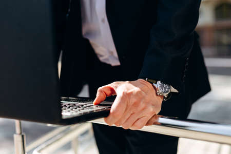 closeup male hand on keyboard of laptop. - Imageの写真素材