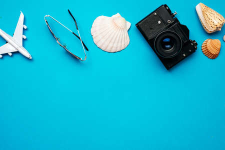 Travel stuff on a blue background, place for advertising. High quality photoの写真素材