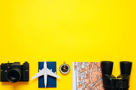 Important things for the traveler are laid out on a yellow, bright background. High quality photoの写真素材