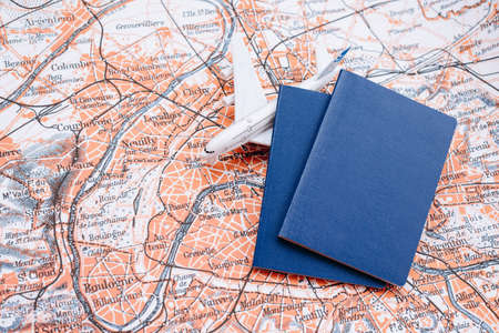 Passports and model airplane on a world map background. High quality photoの写真素材