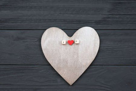 Wooden heart lies on wooden background. Love events concept, valentines dayの写真素材
