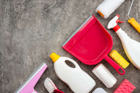 Household accessories lying on diagonal on a gray decorative plaster background. Copy spaceの写真素材