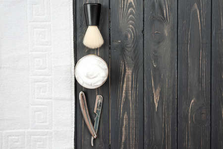 Image of shaving tools: brush, foam, shaver, towel.の写真素材