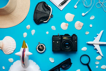Top view of travel accessories set on blue background. High quality photoの写真素材