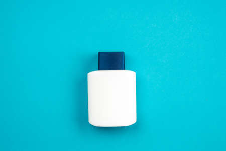 Men cosmetic product aftershave on blue backgroundの写真素材