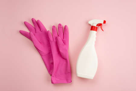 Latex gloves, spray lying on a pink background, copy spaceの写真素材