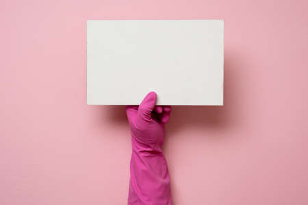 On a pink background, cleaning gloves, place for writing text, copy spaceの写真素材