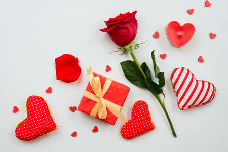 On a white background is a composition of red roses, gifts and hearts. Valentine's Day themの写真素材
