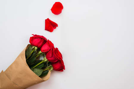 Red roses and petals shape ornaments on white backgroundの写真素材