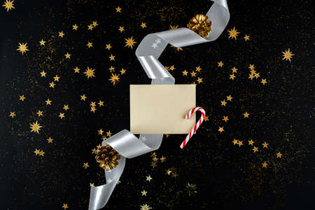 On a New Year background envelope with greetings and candyの写真素材