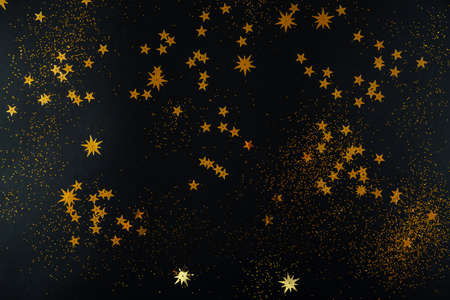 Golden stars on black background. Flat lay, top view.の写真素材