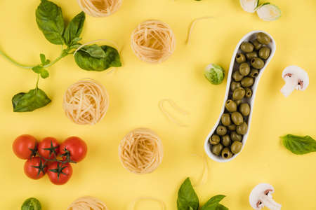 Pasta, basil, olives. Background of products. Top view.の写真素材