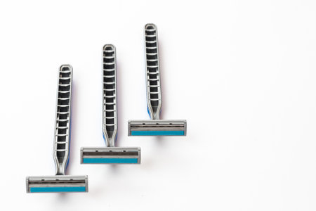 Blue men razor isolated on white background.の写真素材