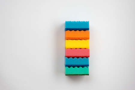 Multi-colored sponges for washing dishes  on a white background. - Imageの写真素材