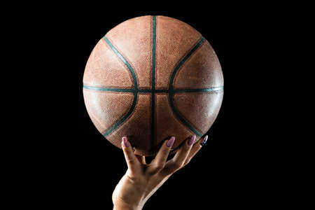 Basketball ball in a handの写真素材