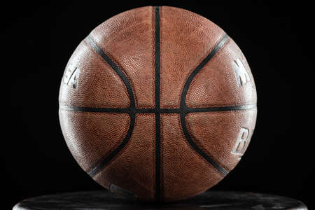 Classic Basketball ball against black backgroundの写真素材