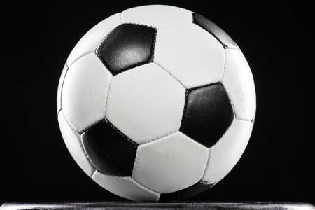 soccer ball against black backgroundの写真素材