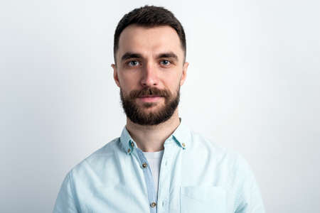 Portrait of bearded guy  and calmly looking at the cameraの写真素材