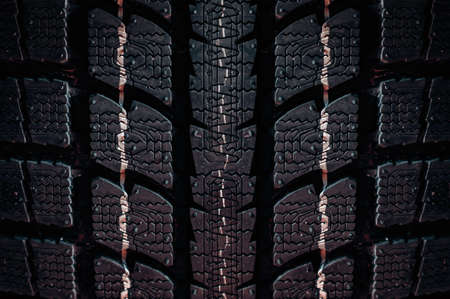 Close up on a tire on a dark backgroundの写真素材