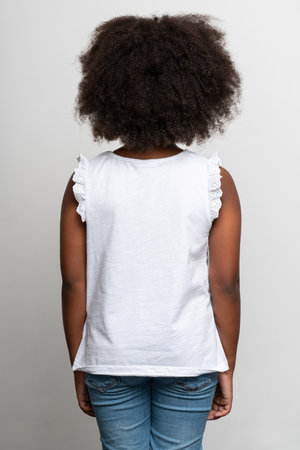 Back view of the multiracial girl wearing white T shirt. Childhood concept. Isolated on white...