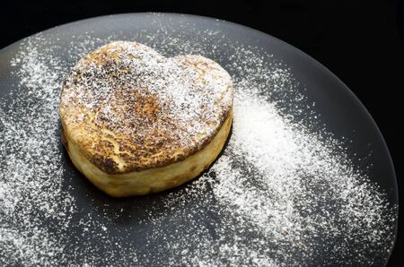 Cottage cheese casserole with heart shaped sugarの写真素材