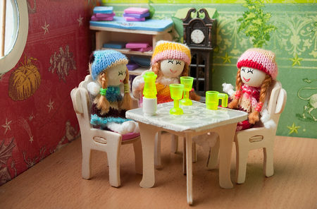 dolls at the tableの写真素材
