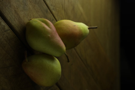 Ripe pears on a wooden background. Selective focus.の写真素材
