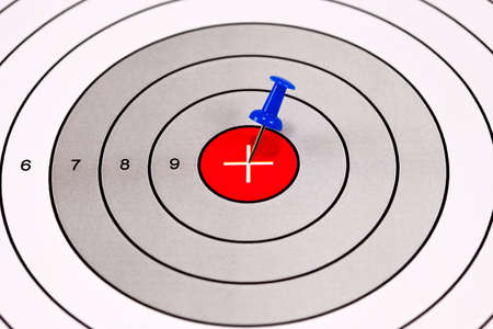 Blue Pin in a Red Centered Target With Crosshairの写真素材