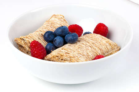 Healthy breakfast of wholewheat, blueberries and rasberriesの写真素材