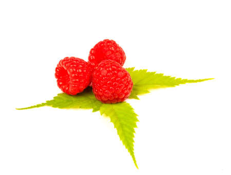 three raspberries on three leaves on white background