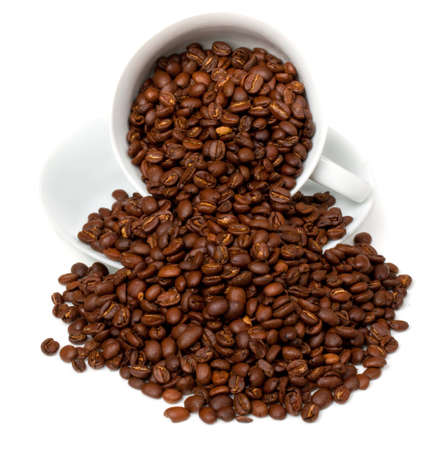 Coffe Beans  spilling out of white cup and saucer