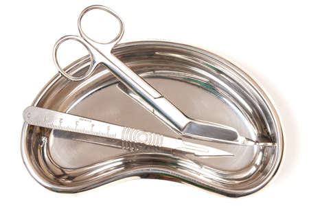 Scalpel and Scissors in stainless steel dishの写真素材