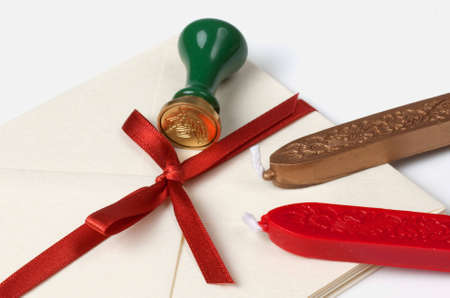 Old fashioned sealing wax and seal with evelopesの写真素材